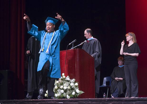 Silverado High School graduate Bogart Banteurt celebrates as his name is announced during the Clark County School District's second annual summer high school graduation ceremony for summer school graduates and at-risk students at the Las Vegas Academy in downtown Las Vegas Wednesday, Aug. 14, 2013.