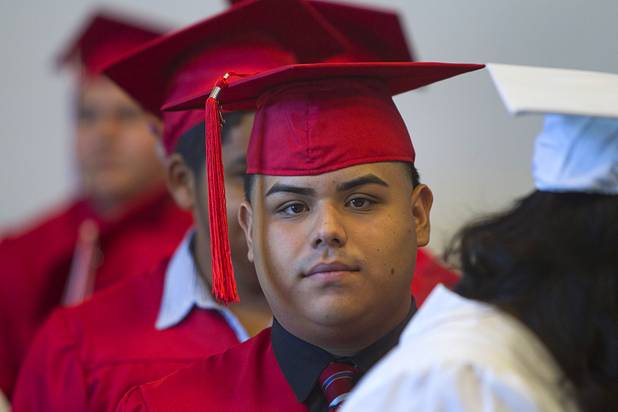 Marlon Hernandez of Valley High School lines up for Clark County School District's second annual summer high school graduation ceremony for summer school graduates and at-risk students at the Las Vegas Academy in downtown Las Vegas Wednesday, Aug. 14, 2013.
