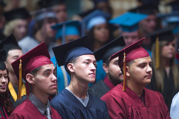 Graduates listen to a keynote address by Las Vegas City Councilman Ricki Barlow during the Clark County School District's second annual summer high school graduation ceremony for summer school graduates and at-risk students at the Las Vegas Academy in downtown Las Vegas Wednesday, Aug. 14, 2013.