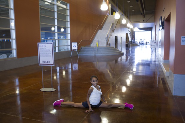 Diana Fleming, 9, poses at the new fitness center on Nellis Air Force Base Thursday, Aug. 15, 2013. The $25 million fitness facility is the result of a partnership between the City of North Las Vegas and the U.S. Air Force. The Air Force is leasing the city a parcel for the city's water treatment facility and the city paid the Air Force $25 million to build the new fitness center.
