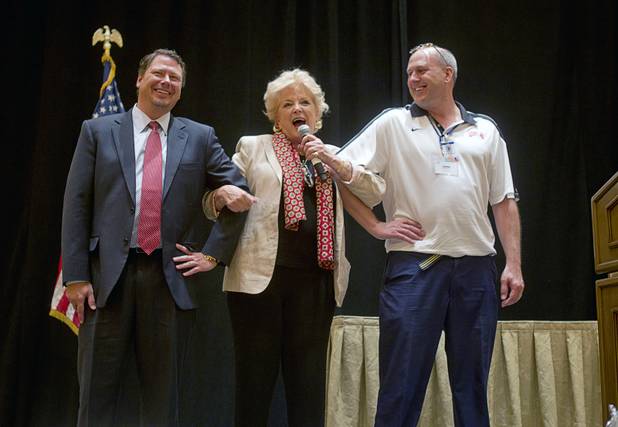 In lieu of showgirls, Las Vegas Mayor Carolyn Goodman poses with Clark County School District Superintendent Pat Skorkowsky, left, and new teacher Lance Jesperson during a CCSD orientation session for new teachers at the Venetian Thursday, Aug. 15, 2013. Over 1,700 teachers took part in the orientation.