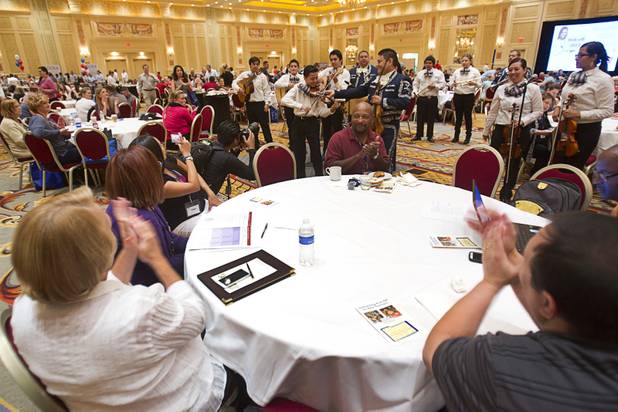 Teachers applaud after being serenaded by mariachis, Clark County School District students, during a CCSD orientation session for new teachers at the Venetian Thursday, Aug. 15, 2013. Over 1,700 teachers took part in the orientation.