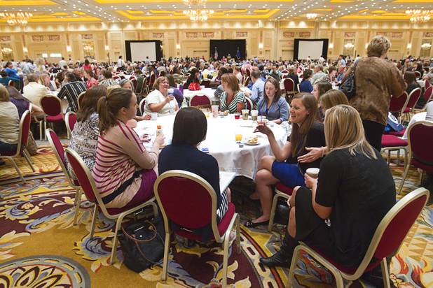 Teachers chat before the start of a Clark County School District orientation session for new teachers Thursday, Aug. 15, 2013, at the Venetian. More than 1,700 teachers took part in the orientation.