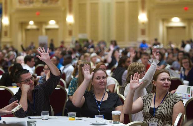 New teachers give a show of hands in response to a question about teaching experience during a Clark County School District orientation session for new teachers at the Venetian Thursday, Aug. 15, 2013. Over 1,700 teachers took part in the orientation.