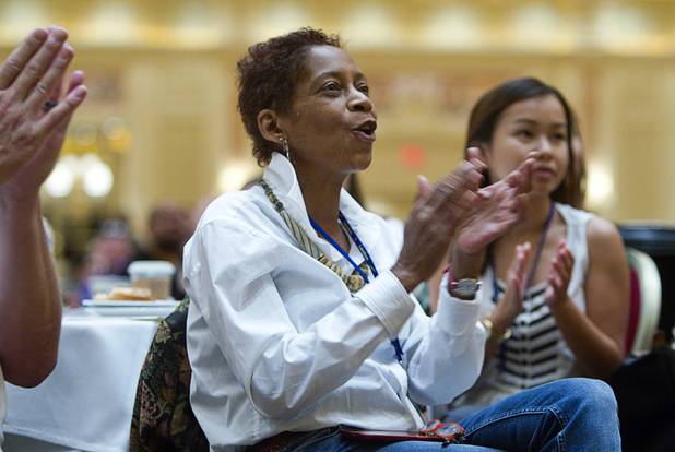 New teacher Victoria Wiseman, center, applauds Las Vegas Mayor Carolyn Goodman during a Clark County School District orientation session for new teachers at the Venetian Thursday, Aug. 15, 2013. Over 1,700 teachers took part in the orientation.