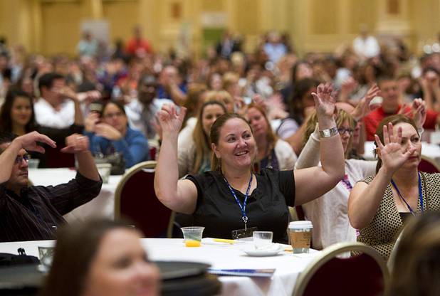 New teachers "loosen up" as Scott Flansburg, Guinness World Record holder for fastest Human Calculator, gives a demonstration of his abilities during a Clark County School District orientation session for new teachers at the Venetian Thursday, Aug. 15, 2013. Over 1,700 teachers took part in the orientation.