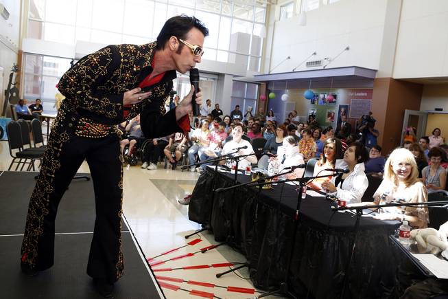 Tony Felicetta performs in an Elvis impersonator contest on the anniversary of Elvis' death at Opportunity Village Engelstad Campus in Las Vegas on Friday, August 16, 2013.