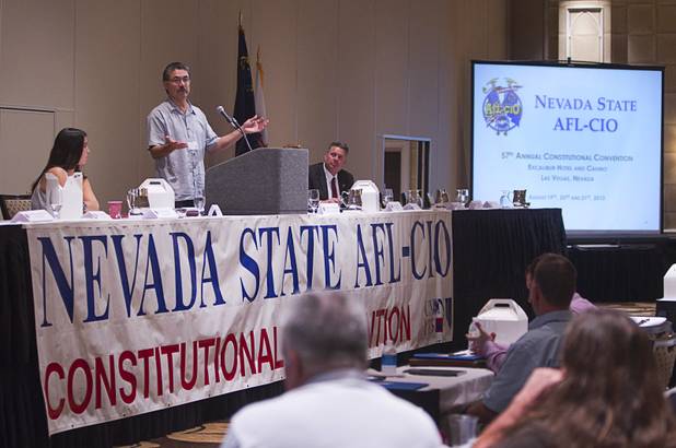 Arturo Mendoza, center, a field campaign director, speaks to union members during the Nevada State AFL-CIO convention at the Excalibur Tuesday, Aug. 20, 2013.