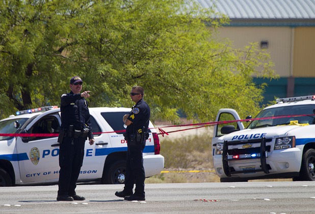 Henderson Police investigate an officer-involved shooting near Boulder Highway and College Drive in Henderson, Aug. 20, 2013.