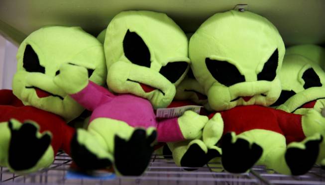 Plush aliens sit for sale among other extraterrestrial-themed souvenirs at the Little A'Le'Inn, located nine miles up the road from the military testing base known as Area 51, in Rachel, Nev., Aug. 20, 2013. Last week, the CIA released a classified report officially confirming the existence of the military testing base famously rumored to have researched UFOs and alien life, though residents of the area have long known about it.
