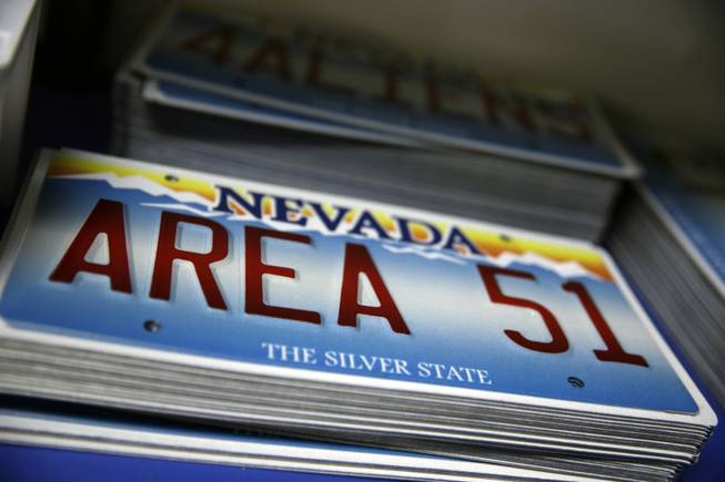 License plates are sold along with other extraterrestrial-themed souvenirs at the Little A'Le'Inn, located nine miles up the road from the military testing base known as Area 51, in Rachel, Nev., Aug. 20, 2013.