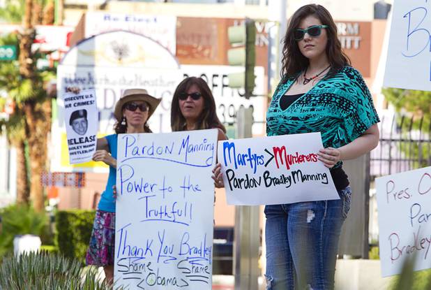 Melanie Layman, right, and others picketers show their support of Army Pfc. Bradley Manning in front of the Lloyd George Federal Building in downtown Las Vegas Wednesday, Aug. 21, 2013. A military judge sentenced Manning to 35 years in prison for leaking hundreds of thousands of classified documents to WikiLeaks.