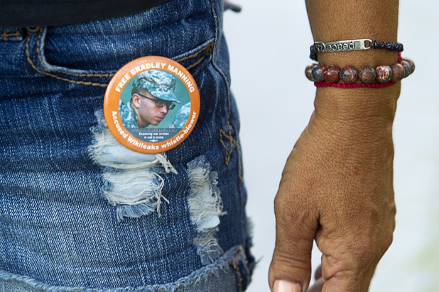 A woman wears a button in support of Army Pfc. Bradley Manning in front of the Lloyd George Federal Building in downtown Las Vegas Wednesday, Aug. 21, 2013. A military judge sentenced Manning to 35 years in prison for leaking hundreds of thousands of classified documents to WikiLeaks.