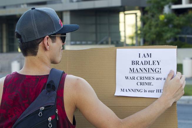 Nicandro Gomez pickets in support of Army Pfc. Bradley Manning in front of the Lloyd George Federal Building in downtown Las Vegas Wednesday, Aug. 21, 2013. A military judge sentenced Manning to 35 years in prison for leaking hundreds of thousands of classified documents to WikiLeaks.