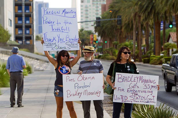 Mary Lou Anderson, left, Jim Nelson and his wife Barbara Nelson picket in support of Army Pfc. Bradley Manning in front of the Lloyd George Federal Building in downtown Las Vegas Wednesday, Aug. 21, 2013. A military judge sentenced Manning to 35 years in prison for leaking hundreds of thousands of classified documents to WikiLeaks.