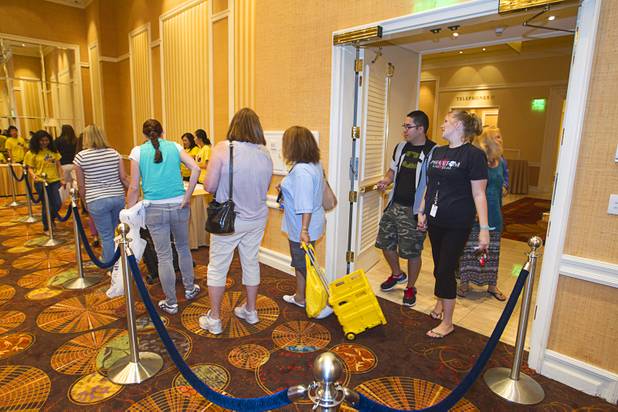 Teacher enter a ballroom stocked with free school supplies during MGM Resorts' annual Educator Appreciation Day and Back to School Fair at the Mirage Thursday, Aug. 22, 2013. More than 18,000 teachers were invited to gather schools supplies donated by MGM Resorts employees.