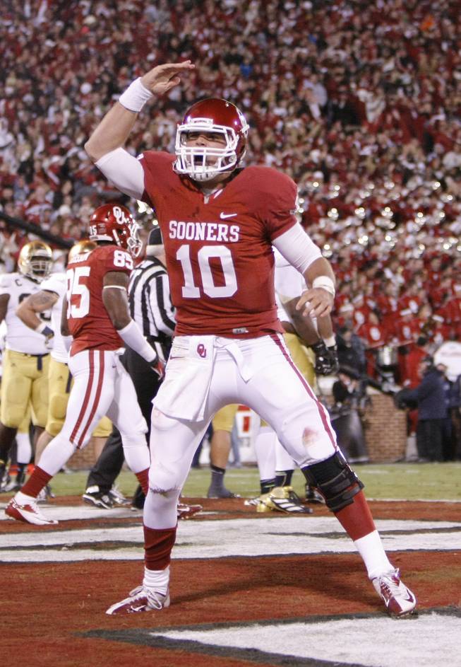 Oklahoma quarterback Blake Bell (10) celebrates during the second half of an NCAA college football game in Norman, Okla., Saturday, Oct. 27, 2012. 