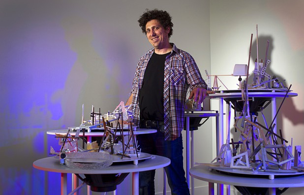 Artist David Sanchez Burr stands behind the New Citadel at the P3 Gallery in the Cosmopolitan Sunday, Aug. 25, 2013.