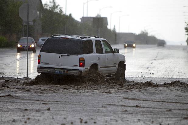 An SUV crosses Grand Teton Drive near Grand Canyon Drive Sunday, Aug. 25, 2013.