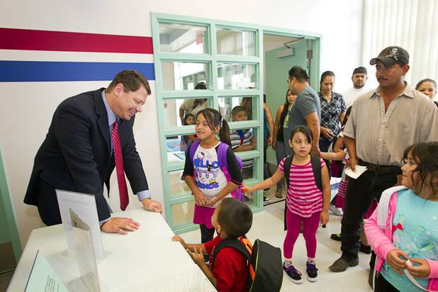 Clark County School District Superintendent Pat Skorkowsky, left, talks with students in the office at Cambeiro Elementary School during the first day of school Monday, Aug. 26, 2013. The school is a "Zoom" school, one of 14 CCSD schools that will receive additional state money and resources to help students who don't speak English.