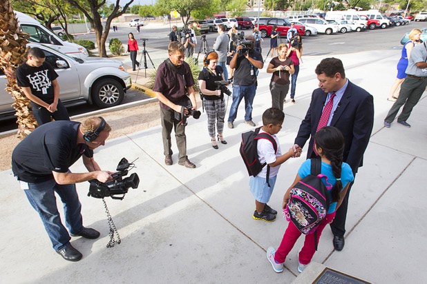 Clark County School District Superintendent Pat Skorkowsky talks with third grader Bryana Garcia and her brother Victor, a first grader during the first day of school at Cambeiro Elementary School Monday, Aug. 26, 2013. When asked if he knew the name of his teacher, Victor replied that his teacher was "TBD" (to be determined).
