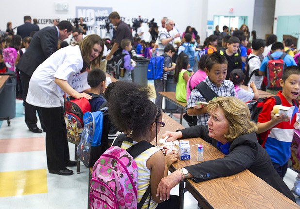 State Assemblywoman Marilyn Dondero Loop, right, talks with a second grader who was feeling nervous about the first day of school at Cambeiro Elementary School Monday, Aug. 26, 2013. The school is a "Zoom" school, one of 14 CCSD schools that will receive additional state money and resources to help students who don't speak English.