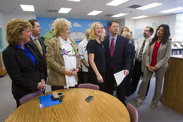 Pam Simone, center, Cambeiro Elementary School principal, is flanked by Las Vegas Mayor Carolyn Goodman and Clark County School District Superintendent Pat Skorkowsky during a news conference in the school library Monday, Aug. 26, 2013. State senators, assembly members, and CCSD school board trustees also attended. The school is a "Zoom" school, one of 14 CCSD schools that will receive additional state money and resources to help students who don't speak English.