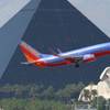 A Southwest Airlines flight approaches McCarran International Airport with the Luxor in the background.
