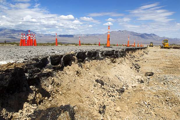 Road crews work to repair a portion of Kyle Canyon Road Tuesday, Aug. 27, 2013. The area was hit hard by storm runoff during Sunday's storm. Kyle Canyon Road reopened to the public Tuesday.