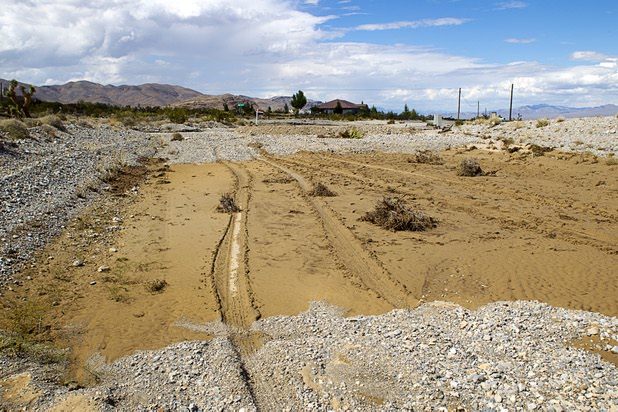 Scottie Road is shown full of mud and debris near Grand Teton Drive in Lower Kyle Canyon Tuesday, Aug. 27, 2013. The area was hit hard by storm runoff during Sunday's storm. Kyle Canyon Road reopened to the public Tuesday.