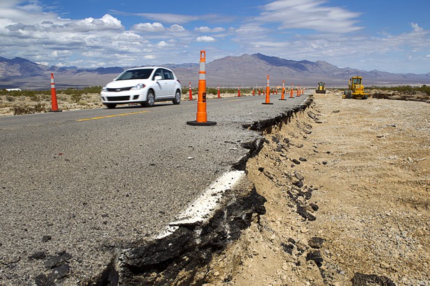 A driver heads up Kyle Canyon Road Tuesday, Aug. 27, 2013. The area was hit hard by storm runoff during Sunday's storm. Kyle Canyon Road reopened to the public Tuesday.