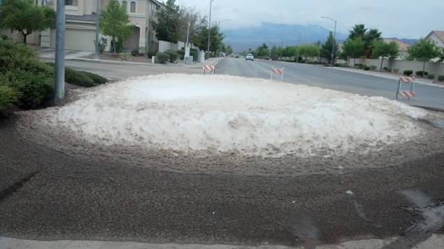 Foam comes out of the storm sewer at the corner of Ackerman Avenue and El Capitan Way in Las Vegas on Monday, August 26, 2013.