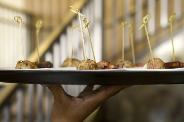 A waiter holds a tray of applewood-smoked bacon and house-made pate served during a preview of the new Echo & Rig Butcher and Steakhouse, 440 S. Rampart Blvd., at Tivoli Village on Tuesday, Aug. 27, 2013.