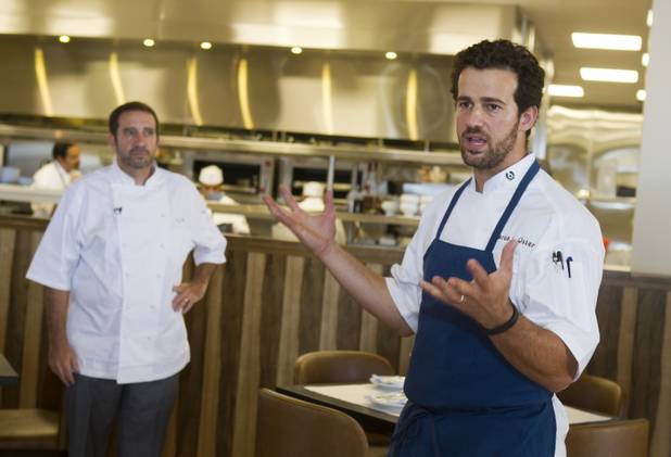 Executive chef Aaron Oster speaks to journalists and other guests during a preview of the new Echo & Rig Butcher and Steakhouse, 440 S. Rampart Blvd., at Tivoli Village on Tuesday, Aug. 27, 2013. Chef and CEO Sam Marvin listens at left.