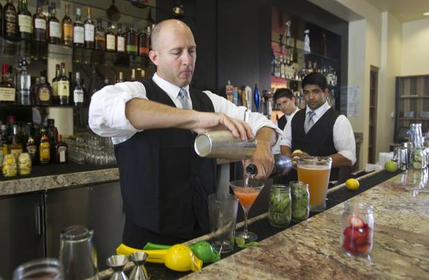 Bartender Justin Lieberknecht mixes a Strawberry Bliss during a preview of the new Echo & Rig Butcher and Steakhouse, 440 S. Rampart Blvd., at Tivoli Village on Tuesday, Aug. 27, 2013.