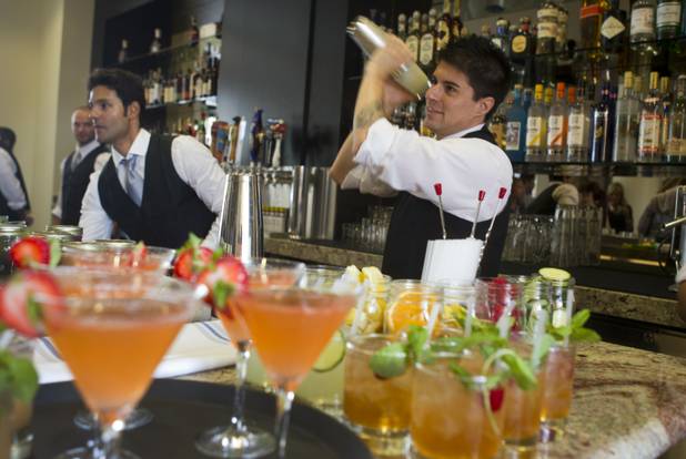 A bartender mixes a cocktail at the new Echo & Rig Butcher and Steakhouse, 440 S. Rampart Blvd., at Tivoli Village on Tuesday, Aug. 27, 2013.