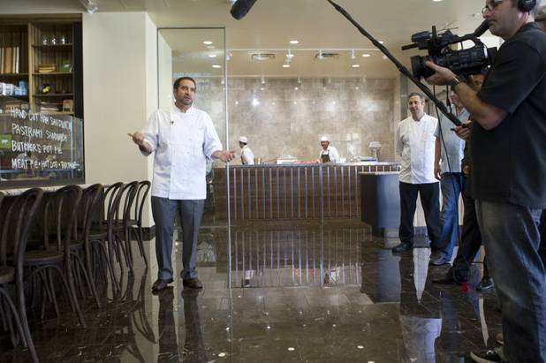 Chef and CEO Sam Marvin speaks with journalists and guests during a preview of the new Echo & Rig Butcher and Steakhouse, 440 S. Rampart Blvd., at Tivoli Village on Tuesday, Aug. 27, 2013. Chef Frank Fronda, chief culinary officer), is at right.