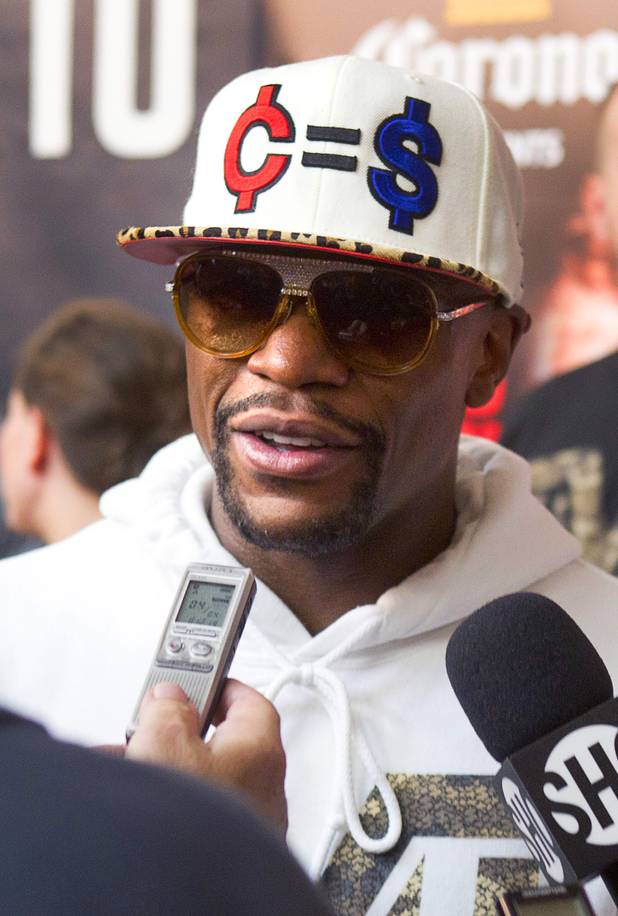 Undefeated boxer Floyd Mayweather Jr. talks with reporters at the Mayweather Boxing Club Wednesday, August 28, 2013. Mayweather will face Canelo Alvarez of Mexico in a WBC/WBA 154-pound title fight at the MGM Grand Garden Arena on September 14.