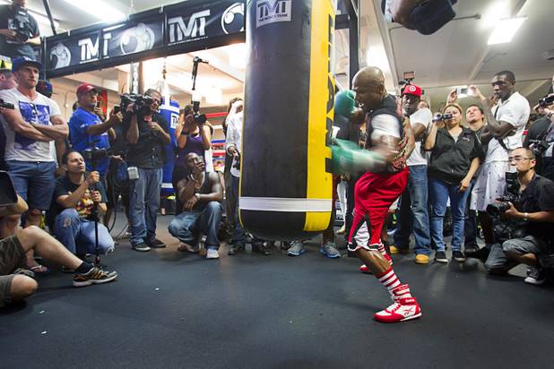 Undefeated boxer Floyd Mayweather Jr. hits a heavy bag at the Mayweather Boxing Club Wednesday, August 28, 2013. Mayweather will face Canelo Alvarez of Mexico in a WBC/WBA 154-pound title fight at the MGM Grand Garden Arena on September 14.