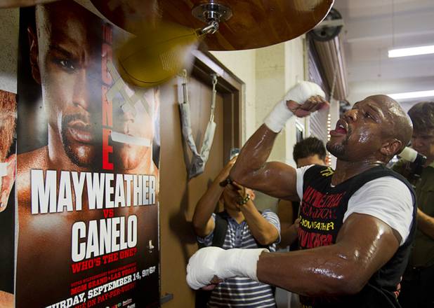 Undefeated boxer Floyd Mayweather Jr. hits a speedbag at the Mayweather Boxing Club Wednesday, August 28, 2013. Mayweather will face Canelo Alvarez of Mexico in a WBC/WBA 154-pound title fight at the MGM Grand Garden Arena on September 14.