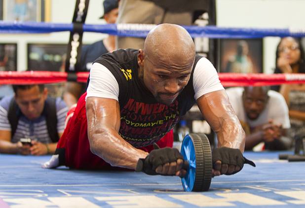 Undefeated boxer Floyd Mayweather Jr. works on his abdominal muscles at the Mayweather Boxing Club Wednesday, August 28, 2013. Mayweather will face Canelo Alvarez of Mexico in a WBC/WBA 154-pound title fight at the MGM Grand Garden Arena on September 14.