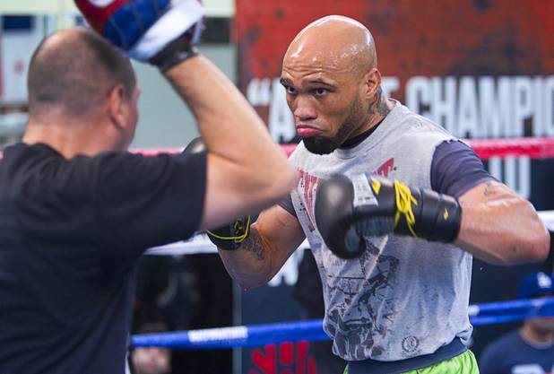IBF 154-pound champion Ishe Smith works on his timing with assistant trainer Rafael Ramos at the Mayweather Boxing Club Wednesday, August 28, 2013. Smith will defend his title against Carlos Molina of Mexico at the MGM Grand Garden Arena on September 14.