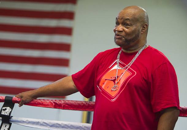 Head trainer Eddie Mustafa Muhammad watches as IBF 154-pound champion Ishe Smith during a workout at the Mayweather Boxing Club Wednesday, August 28, 2013.  Smith will defend his title against Carlos Molina of Mexico at the MGM Grand Garden Arena on September 14.