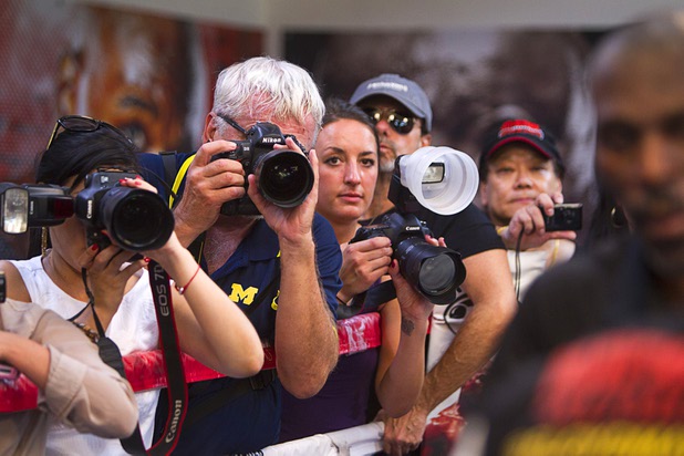 Photographers crowd around the ring as they take photos of Floyd Mayweather Jr. at the Mayweather Boxing Club Wednesday, August 28, 2013. Mayweather will face Canelo Alvarez of Mexico in a WBC/WBA 154-pound title fight at the MGM Grand Garden Arena on September 14.