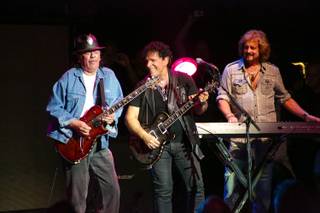 Carlos Santana and Gregg Rolie join Neal Schon onstage during Journey's concert at Pearl at the Palms on Wednesday, Aug. 28, 2013.
