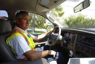 Robert Kern, a meter services field representative for the Southern Nevada Water Authority (SNWA), looks for water waste as he drives through a neighborhood near Rancho Dr. and Oakey Blvd. Thursday, August 29, 2013.