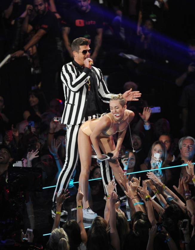 Robin Thicke and Miley Cyrus perform at the MTV Video Music Awards on Sunday, Aug. 25, 2013, at the Barclays Center in Brooklyn, New York.