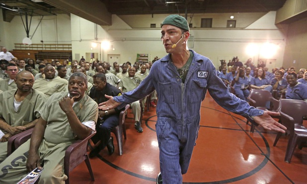 In this Aug. 27, 2013, photo, rapper GQ, aka Gregory Qaiyum, performs during a hip hop adaptation of William Shakespeare's Othello, titled "Othello: The Remix" at the Cook County Jail in Chicago. "Shakespeare was a master storyteller who used musical language and poetry," GQ says, and the same is true of the best rappers. "So at the very basic level theyre doing the exact same thing. ... You're using poetic devices like alliteration and repetition and onomatopoeia. ... They're very similar art forms despite how different they tend to be judged." (AP Photo/M. Spencer Green)