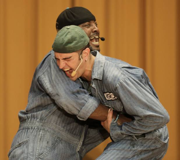 In this Aug. 27, 2013, photo, rappers GQ, front, and Postell Pringle perform a hip hop adaptation of William Shakespeare's Othello, titled "Othello: The Remix" at the Cook County Jail in Chicago. 