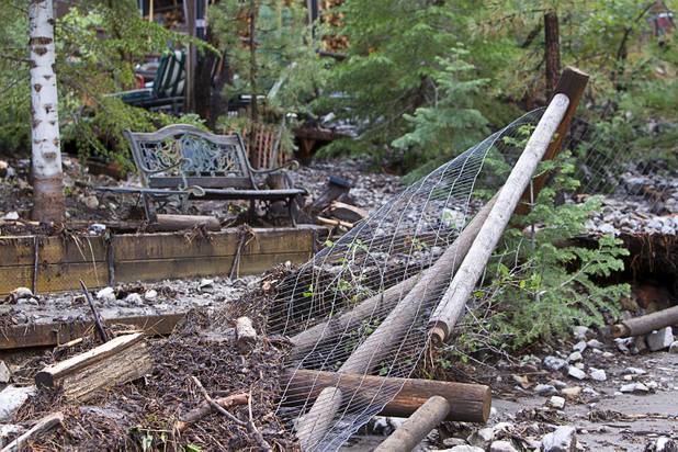 A damaged garden area is shown by a home in the Rainbow Canyon subdivision on Mount Charleston Sunday, Sept. 1, 2013.